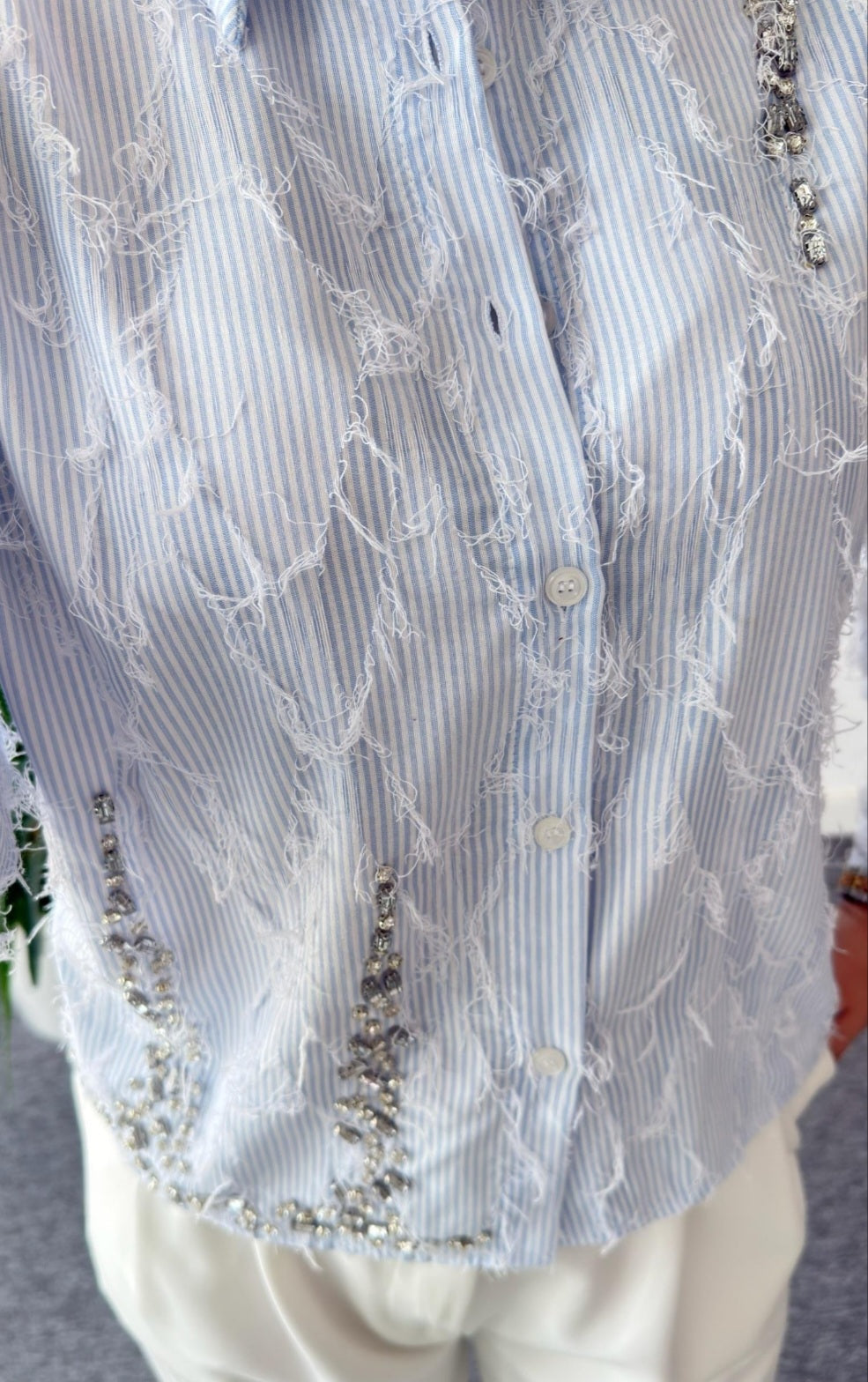 Feathered shirt with rhinestone details