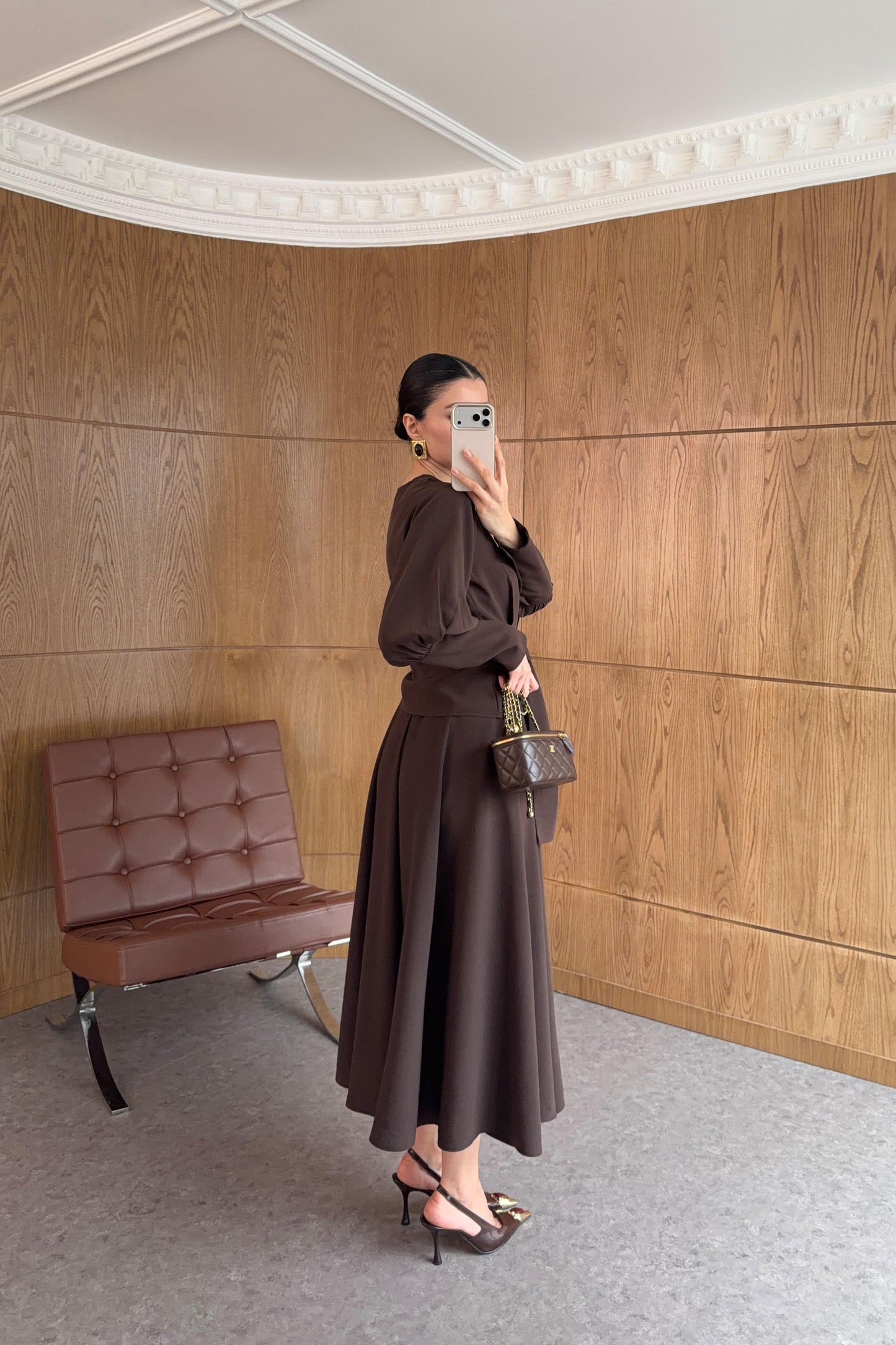 Long-sleeved shirt and wide skirt set with a fixed side belt at the waist.