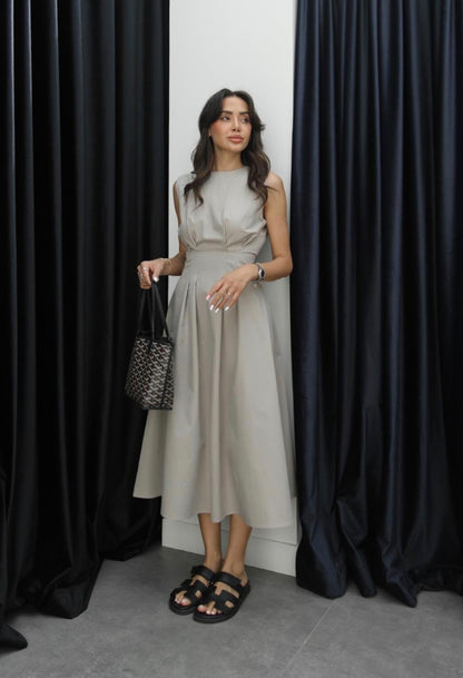 Sleeveless poplin dress with pleats