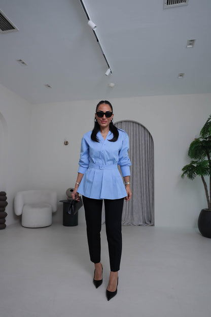 Two-piece shirt (wrappable like a skirt) in blue poplin fabric with an elegant design