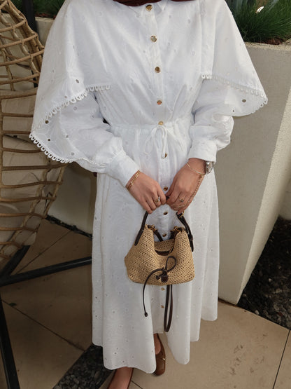 Belted openwork embroidery with gold buttons