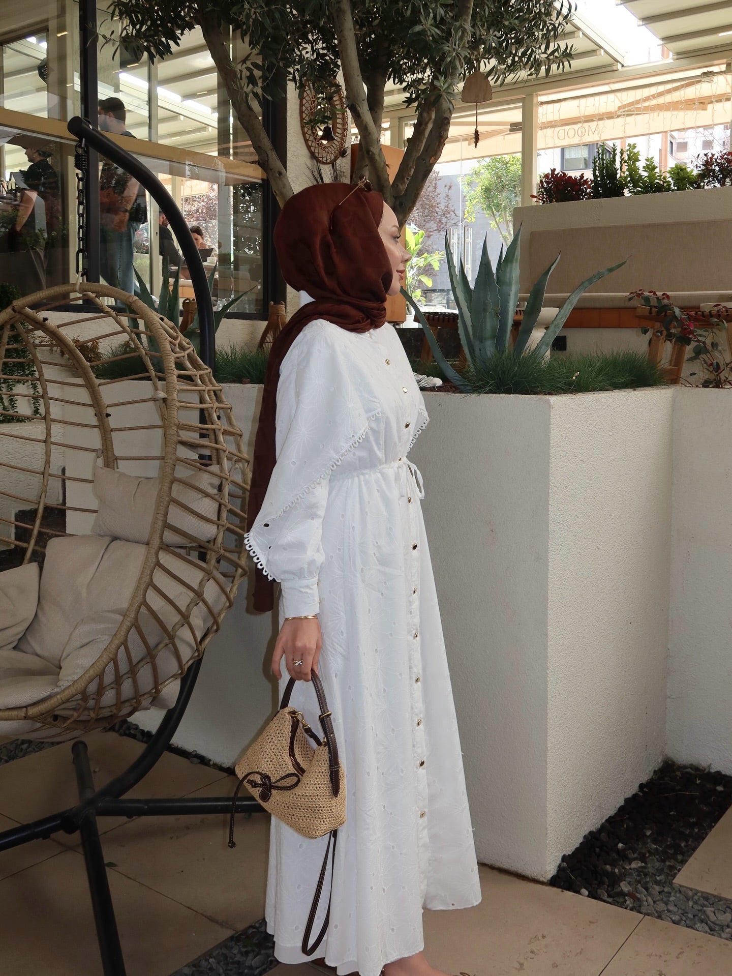 Belted openwork embroidery with gold buttons