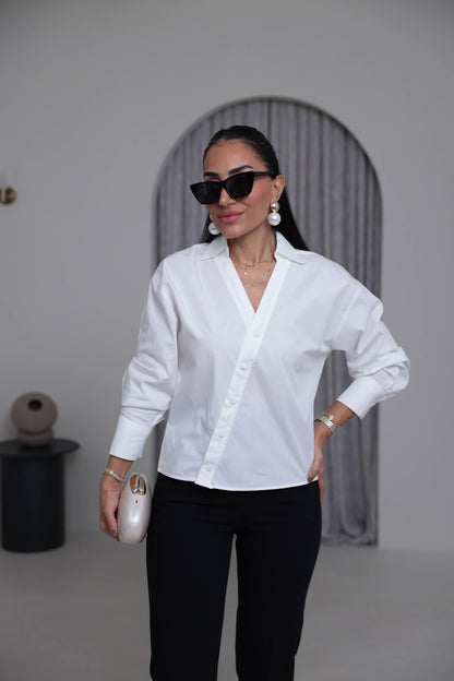 Two-piece shirt (wrappable like a skirt) in white poplin fabric with an elegant design