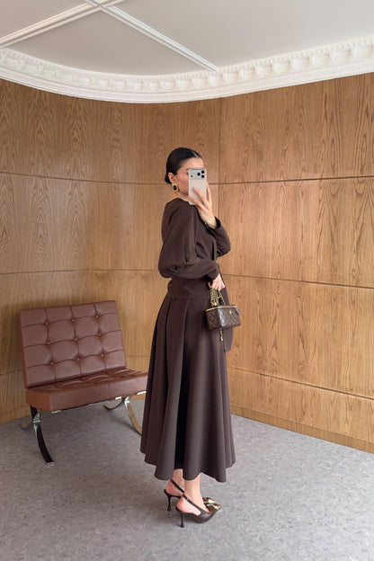 Long-sleeved shirt and wide skirt set with a fixed side belt at the waist.