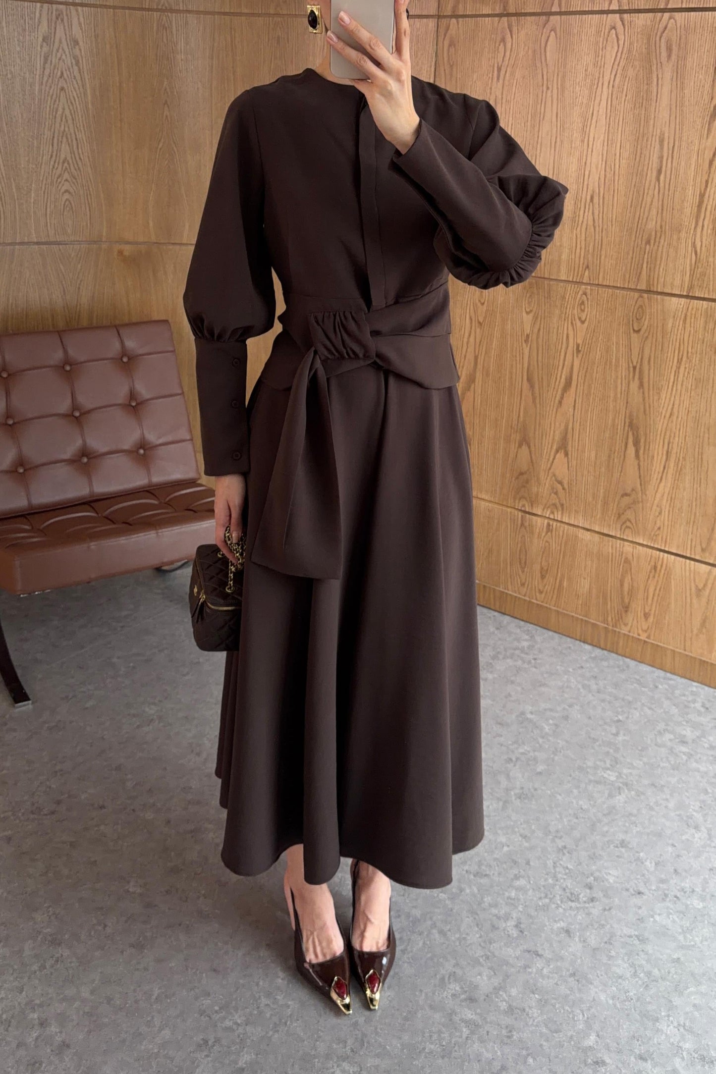 Long-sleeved shirt and wide skirt set with a fixed side belt at the waist.