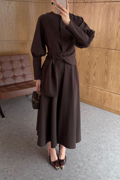 Long-sleeved shirt and wide skirt set with a fixed side belt at the waist.