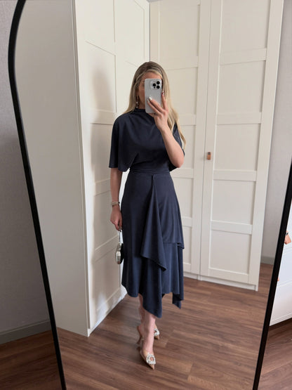 Zara model Loose-fitting top with crew neck  ,Flowing mid-waist midi skirt with an asymmetric hem.