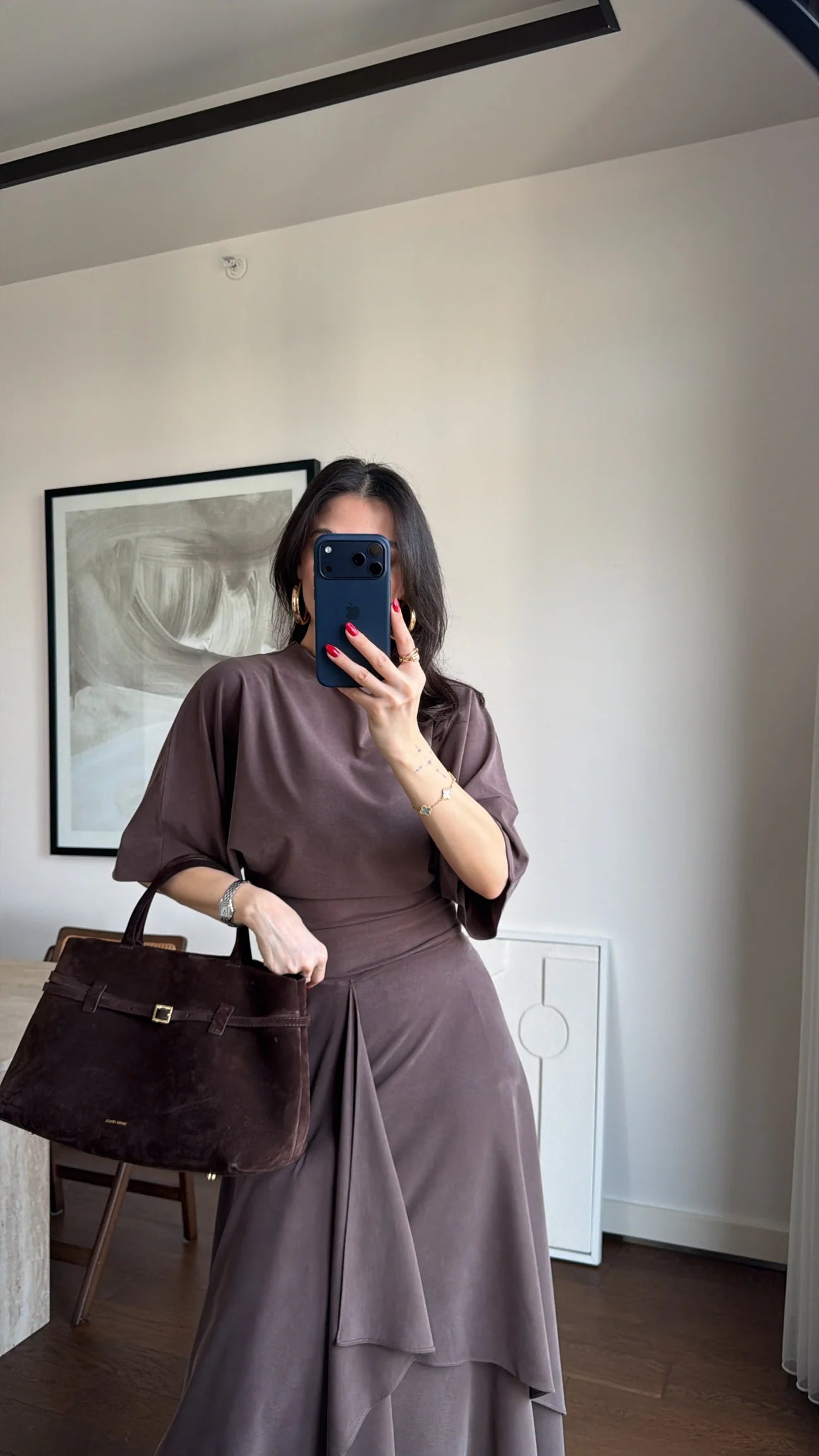 Zara model Loose-fitting top with crew neck  ,Flowing mid-waist midi skirt with an asymmetric hem.