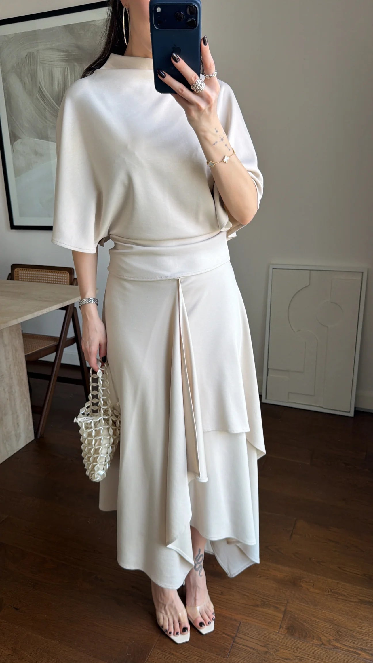 Zara model Loose-fitting top with crew neck  ,Flowing mid-waist midi skirt with an asymmetric hem.