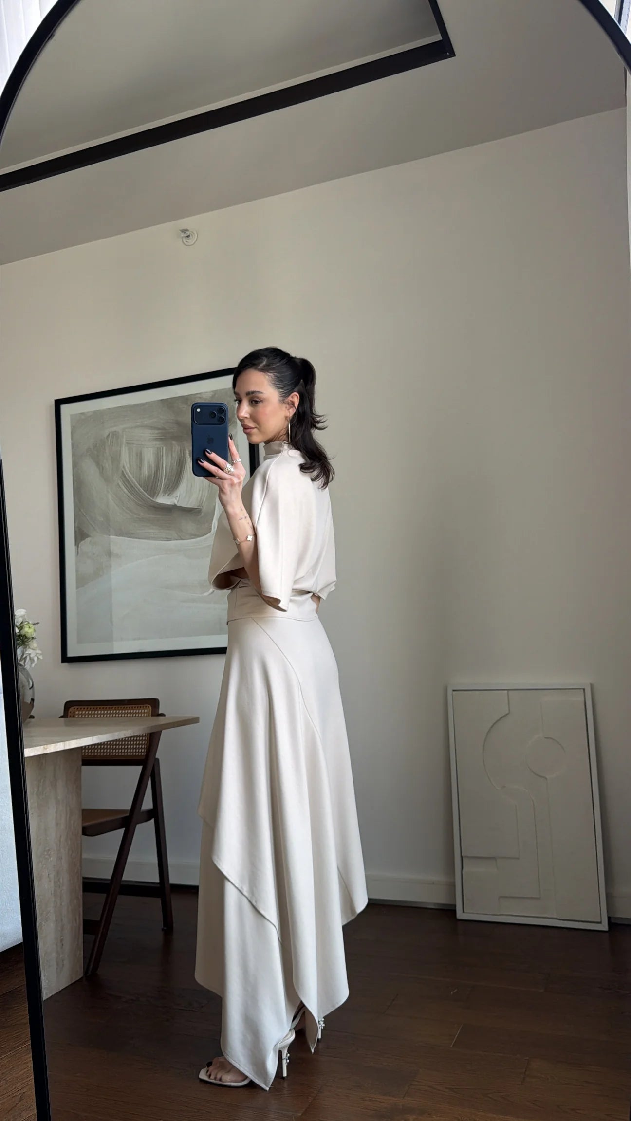Zara model Loose-fitting top with crew neck  ,Flowing mid-waist midi skirt with an asymmetric hem.