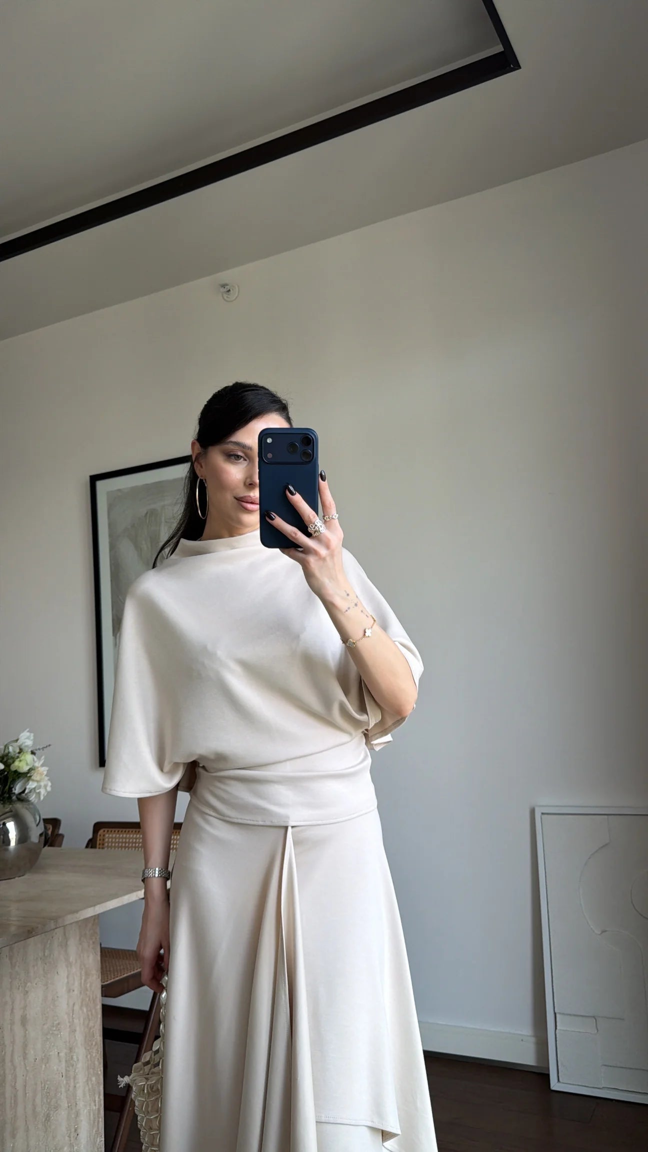 Zara model Loose-fitting top with crew neck  ,Flowing mid-waist midi skirt with an asymmetric hem.