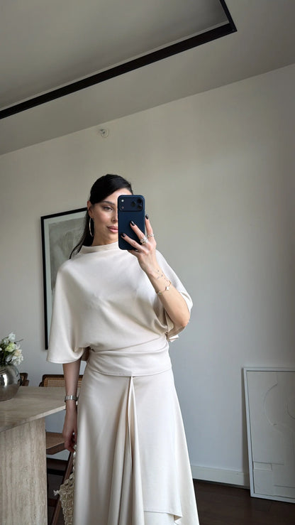Zara model Loose-fitting top with crew neck  ,Flowing mid-waist midi skirt with an asymmetric hem.