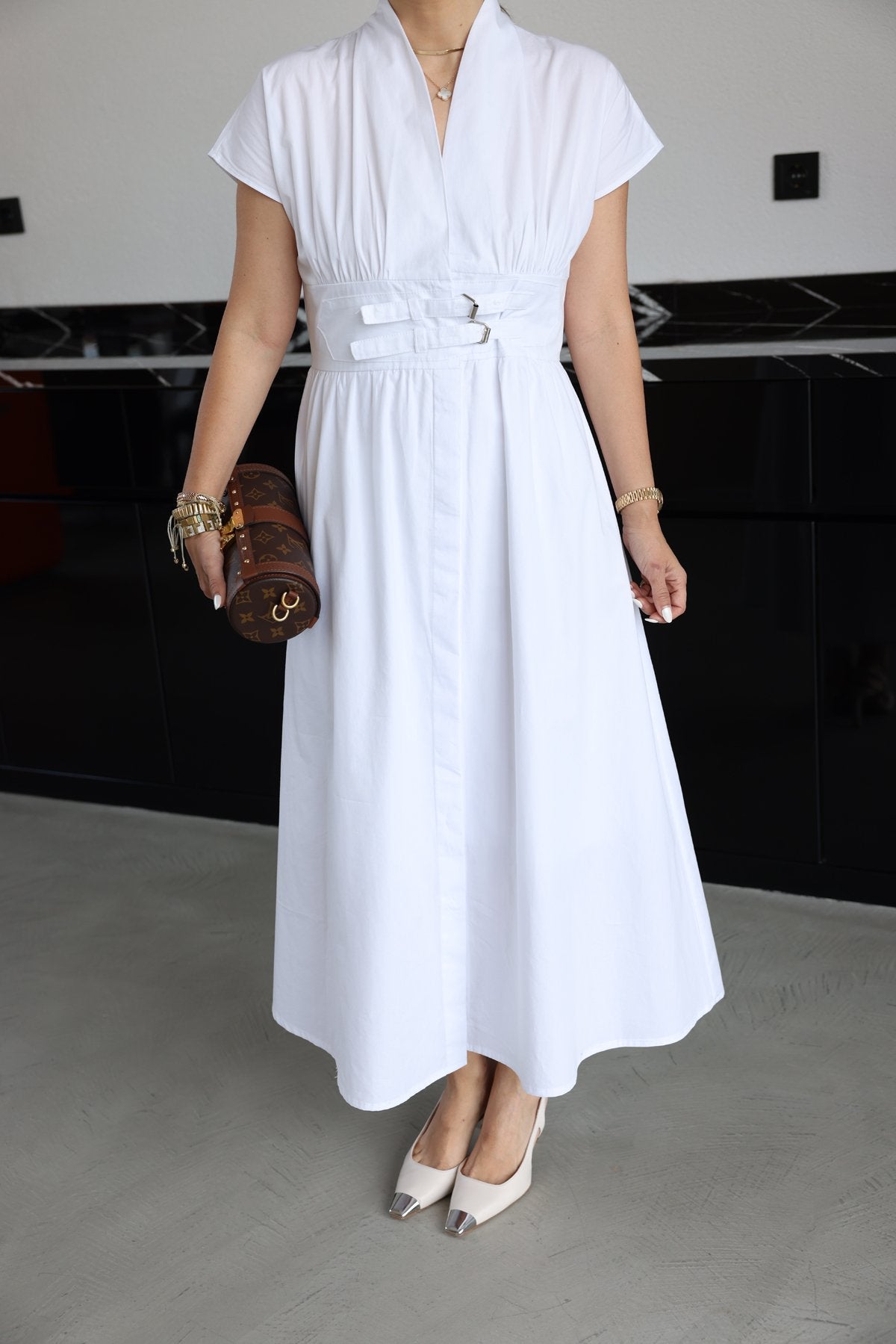 White half-sleeved dress with two belts on the chest