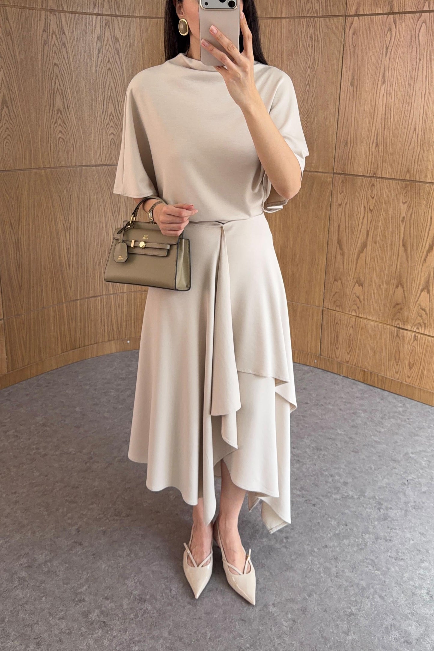Zara model Loose-fitting top with crew neck  ,Flowing mid-waist midi skirt with an asymmetric hem.