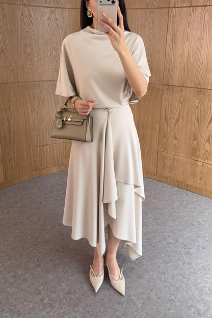 Zara model Loose-fitting top with crew neck  ,Flowing mid-waist midi skirt with an asymmetric hem.