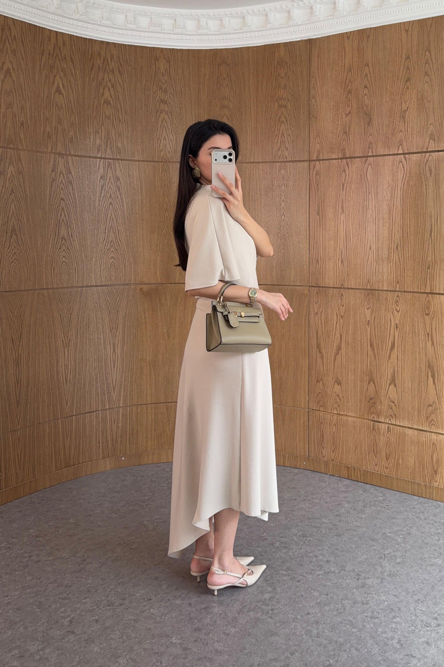 Zara model Loose-fitting top with crew neck  ,Flowing mid-waist midi skirt with an asymmetric hem.